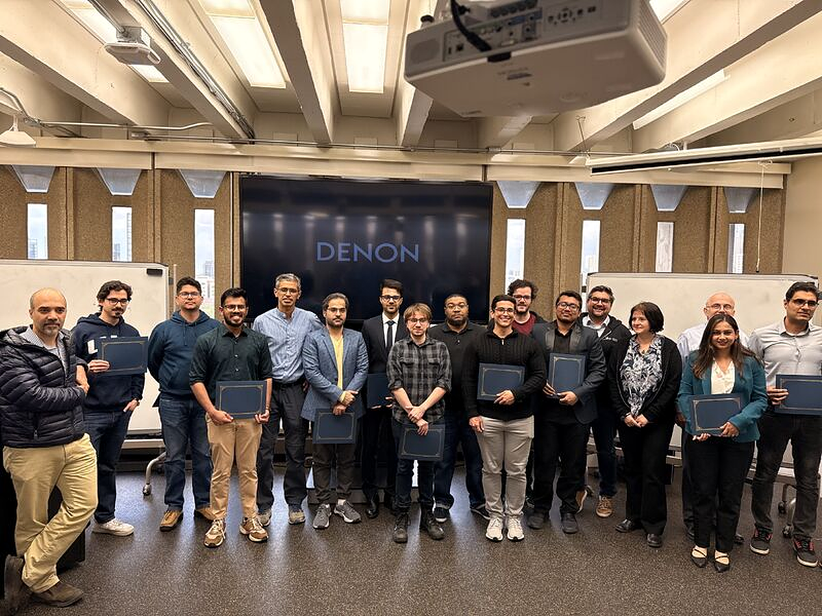 UIC award honorees holding their recognition certificates